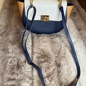Elegant Navy, White, and Tan Crossbody Bag
